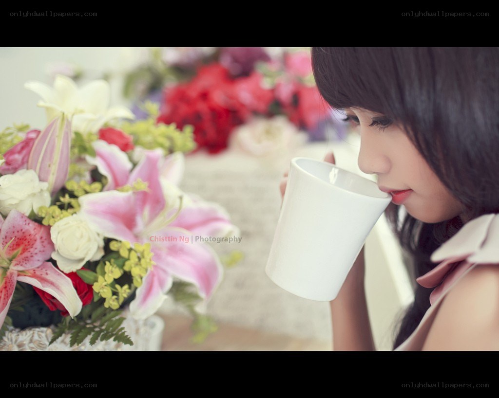 woman drinking from a mug