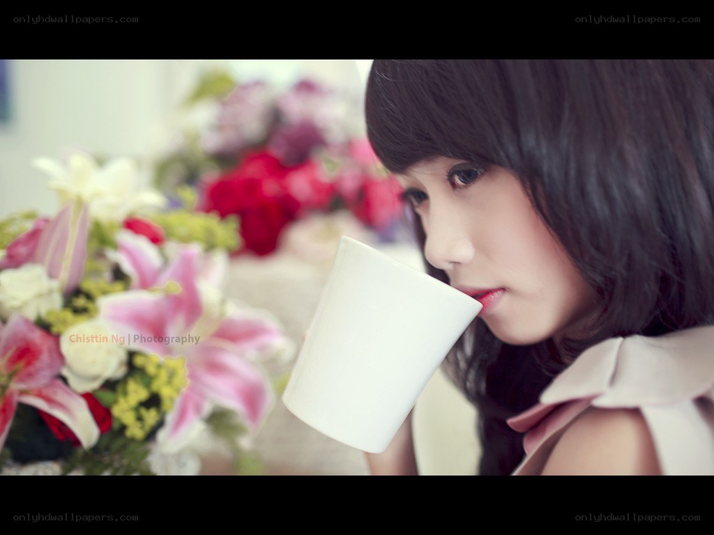 woman drinking from a mug