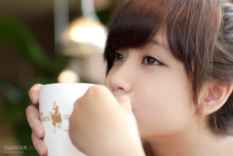 woman drinking from a mug