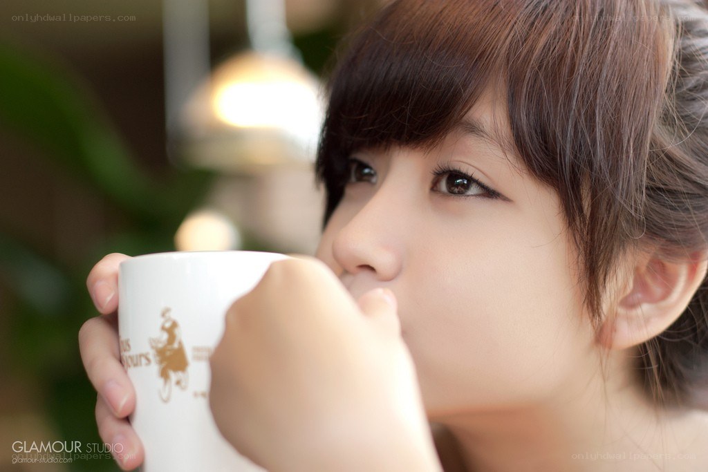 woman drinking from a mug
