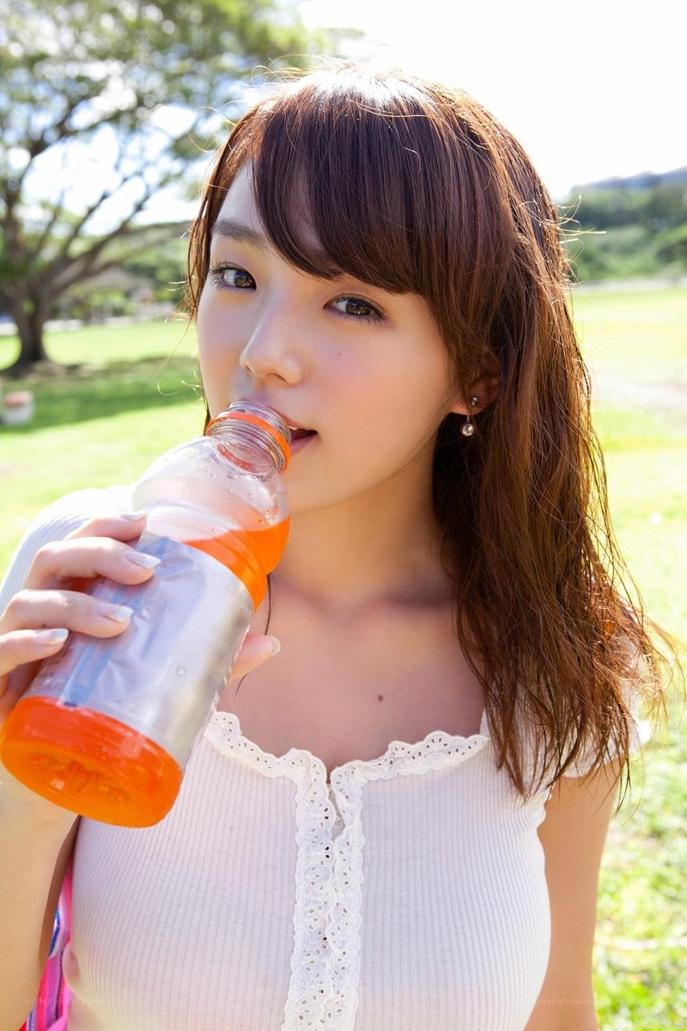 woman drinking from bottle
