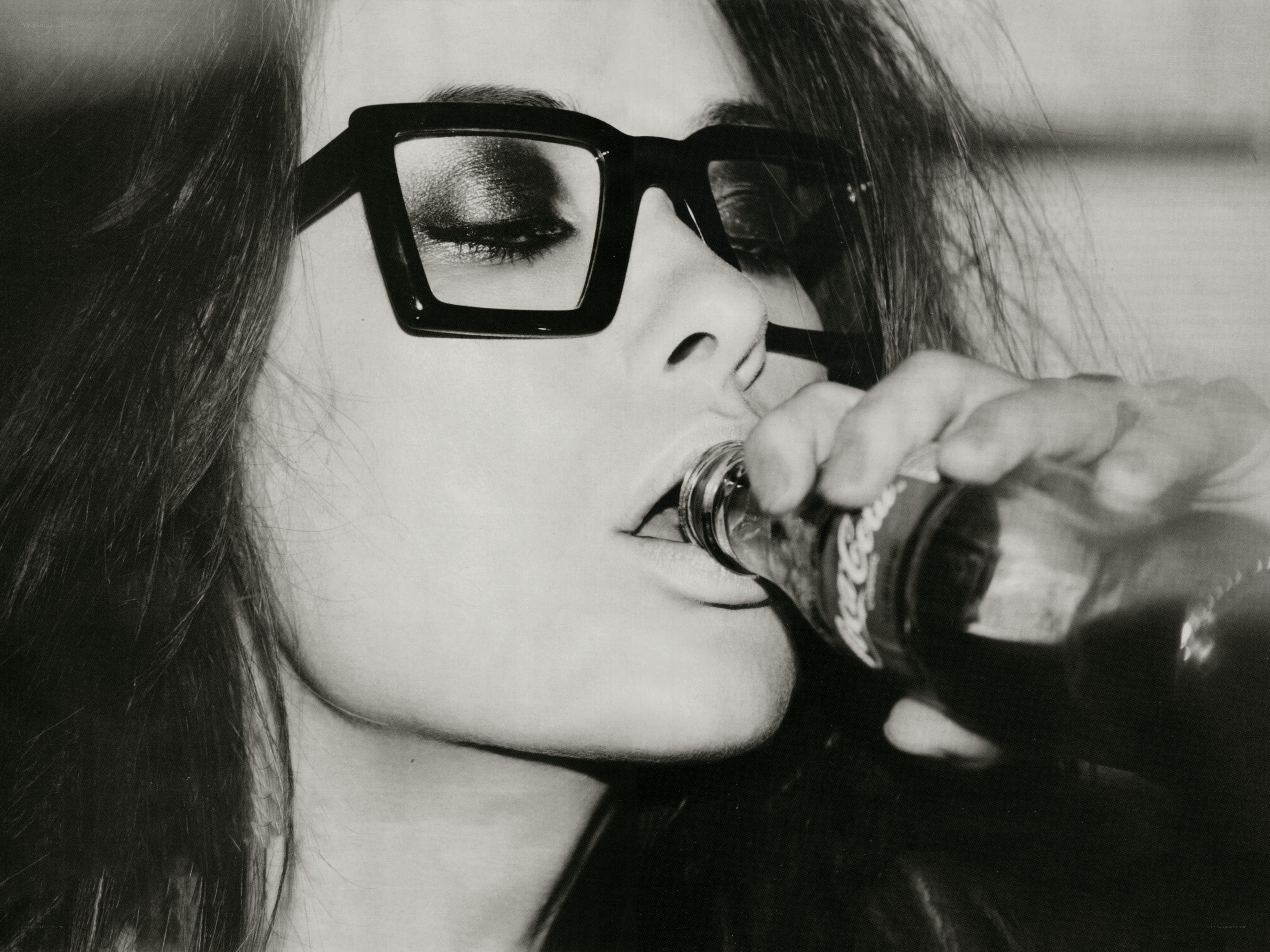 woman drinking from bottle