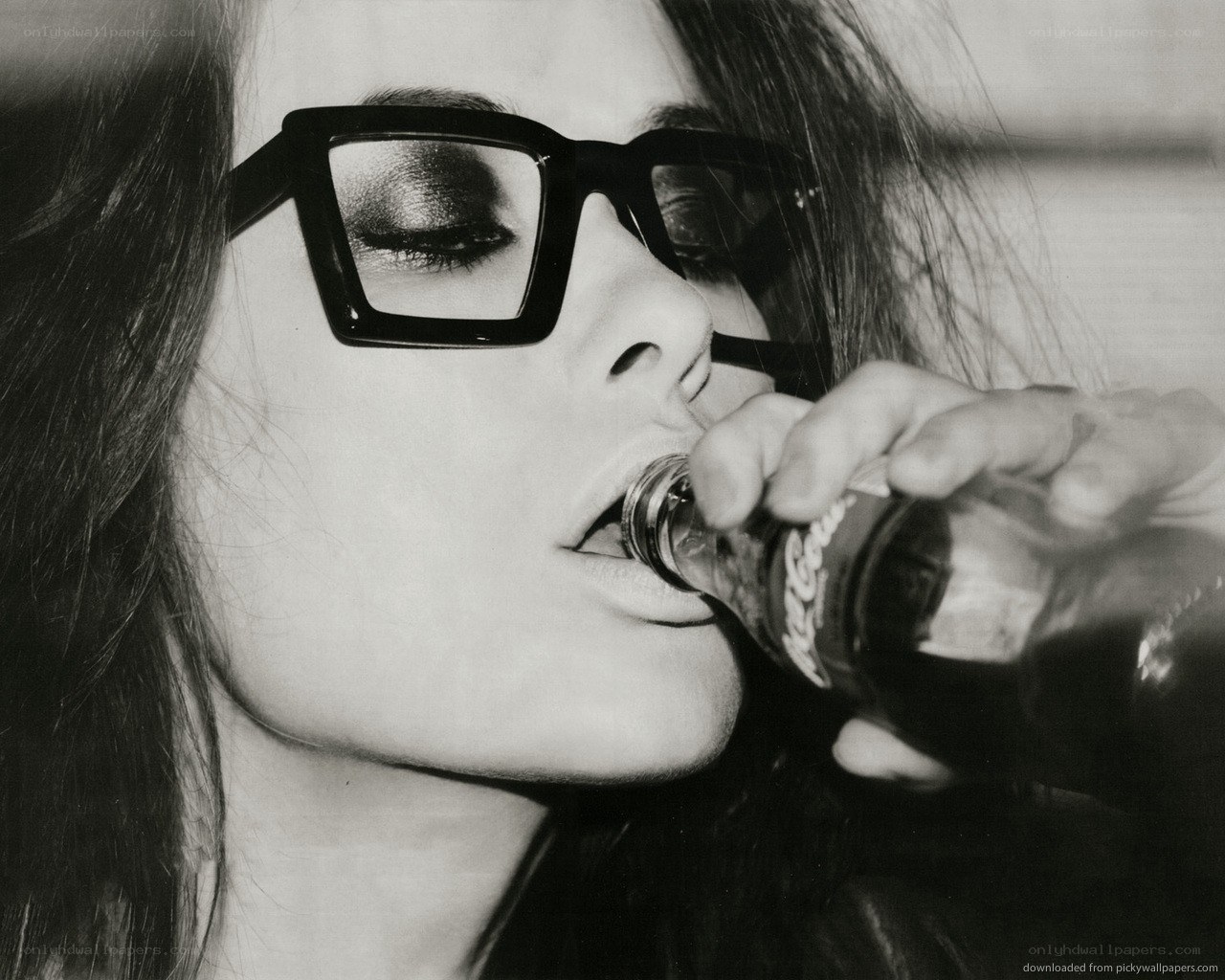 woman drinking from bottle