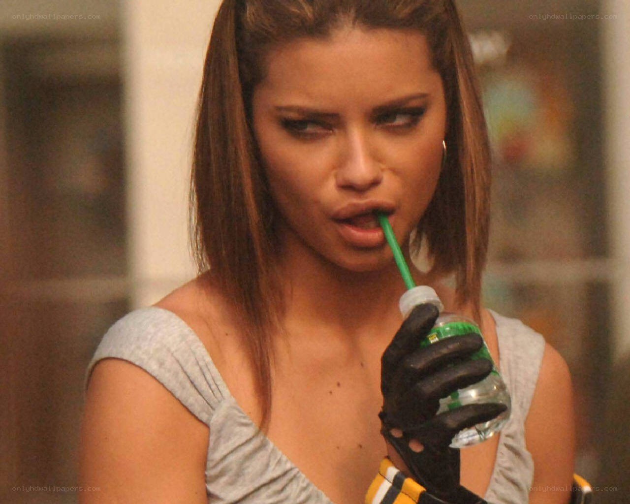 woman drinking from bottle