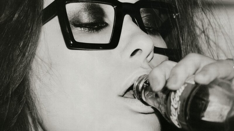 woman drinking from bottle