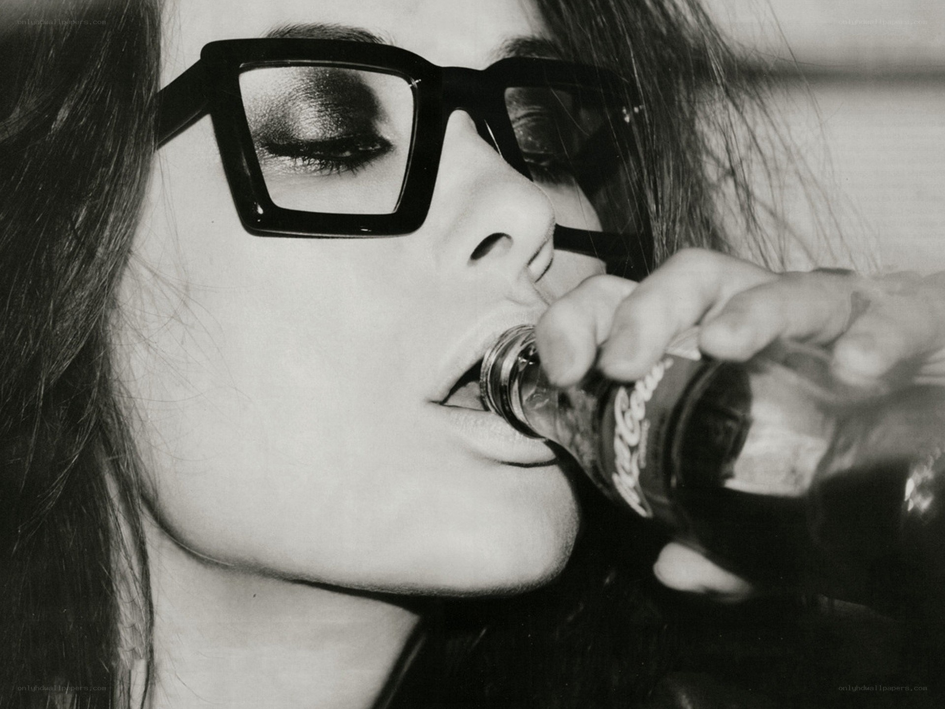 woman drinking from bottle