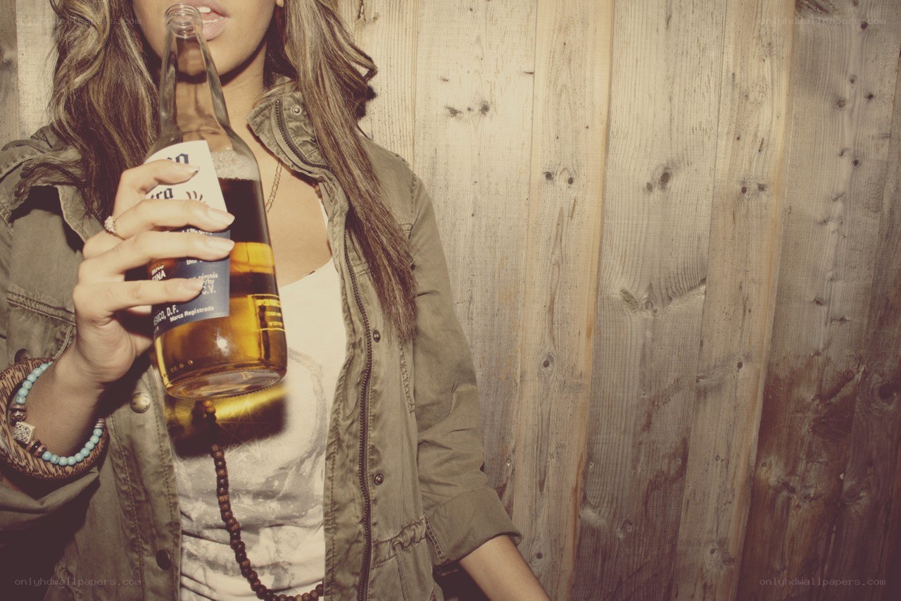 woman drinking from bottle