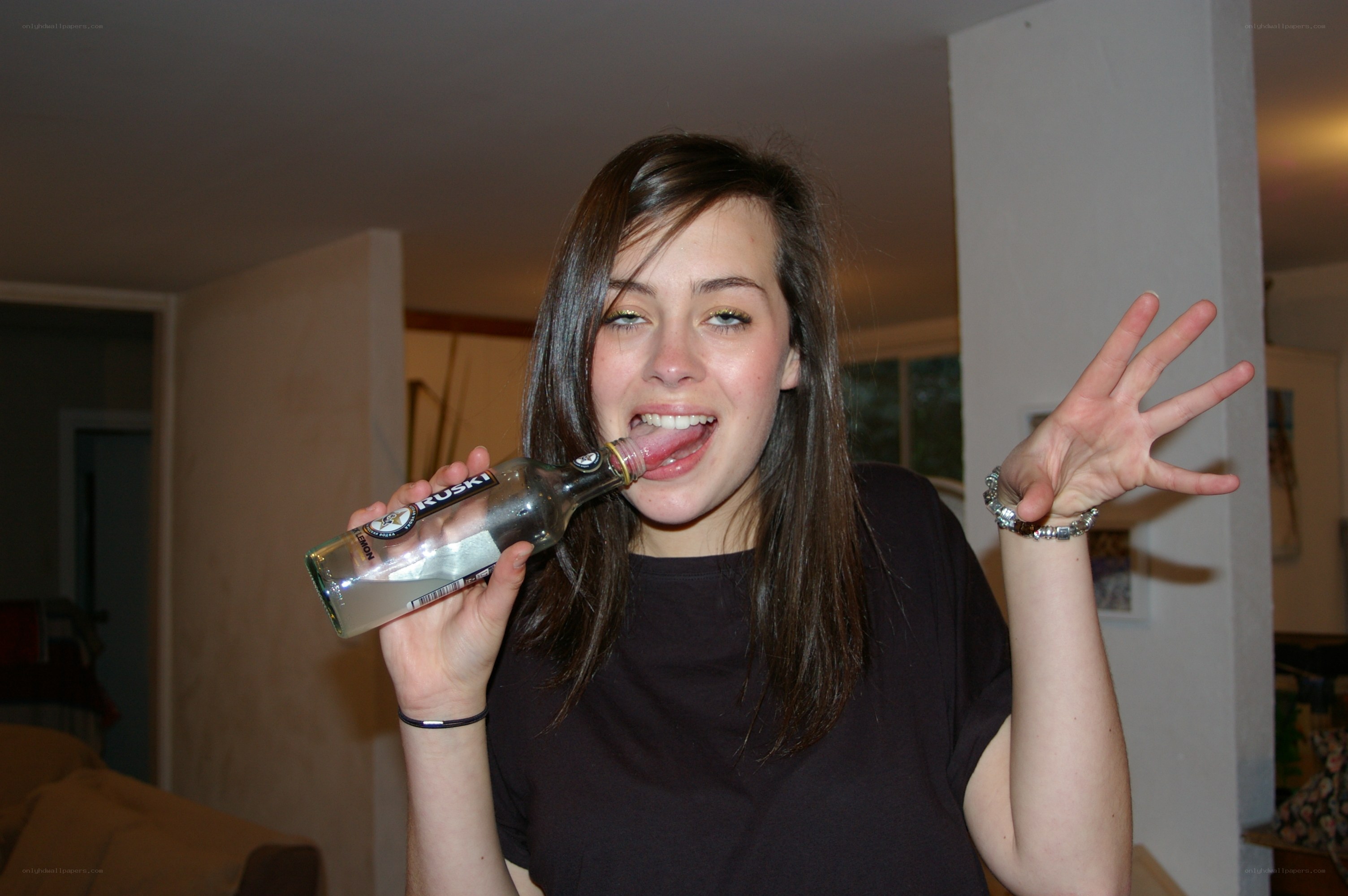 woman drinking from bottle