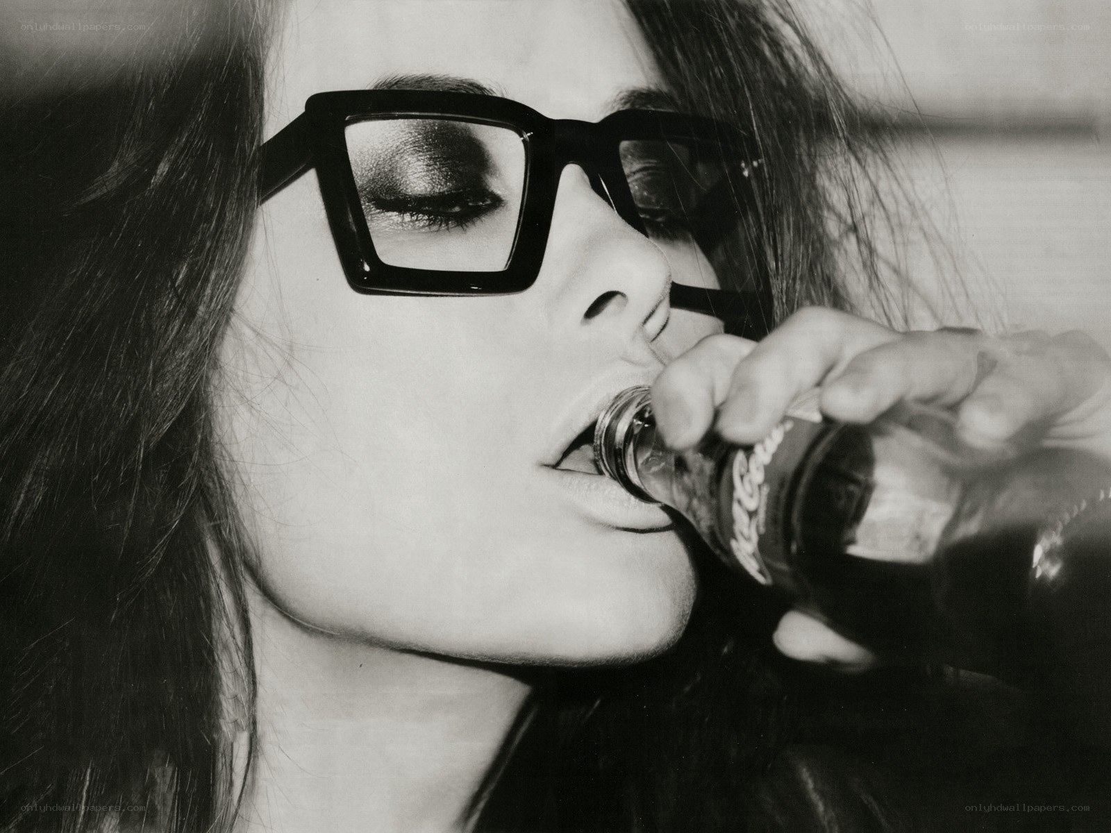 woman drinking from bottle