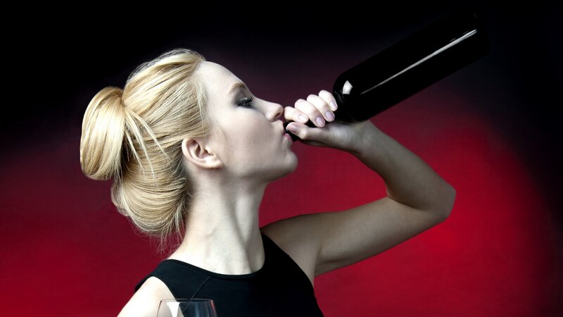 Woman Drinking from Bottle — Red, Dramatic