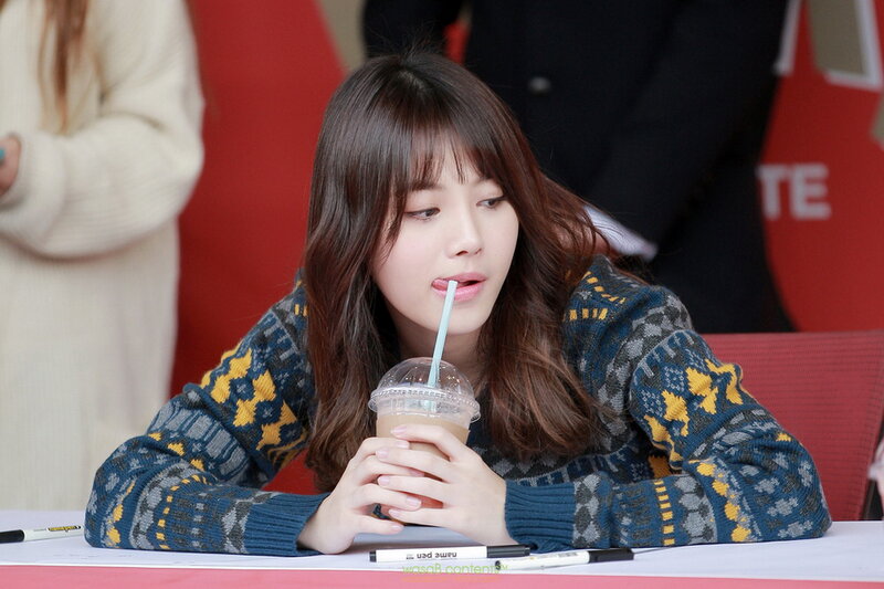 Woman Drinking from Cup — Blue