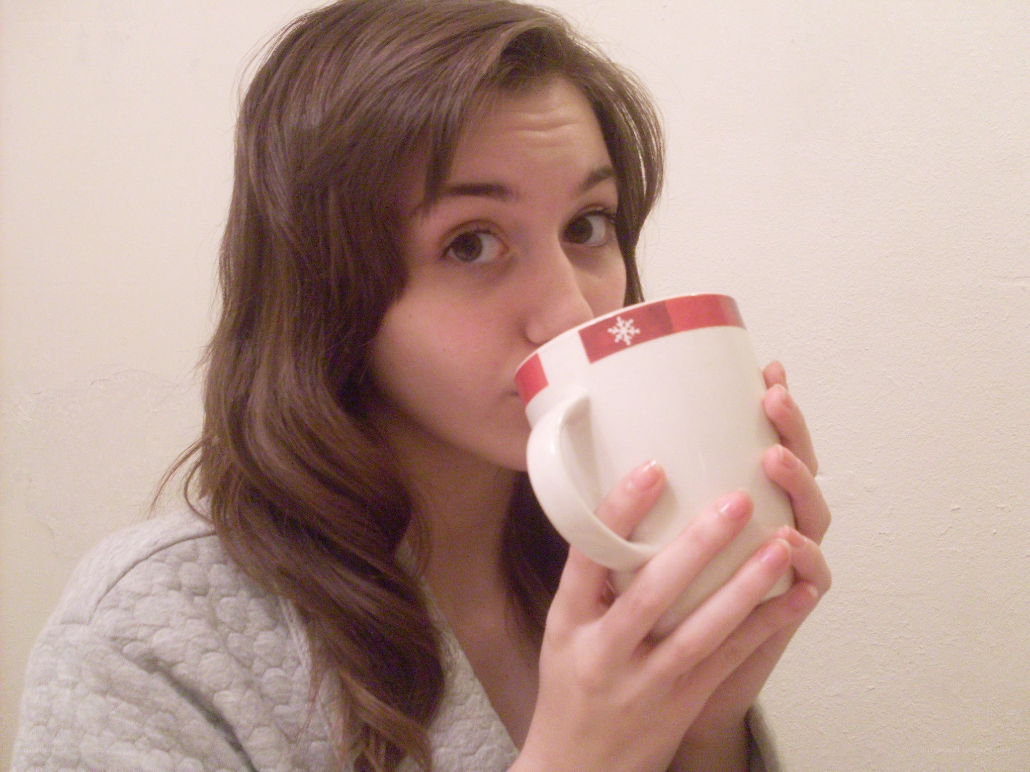 woman drinking from mug