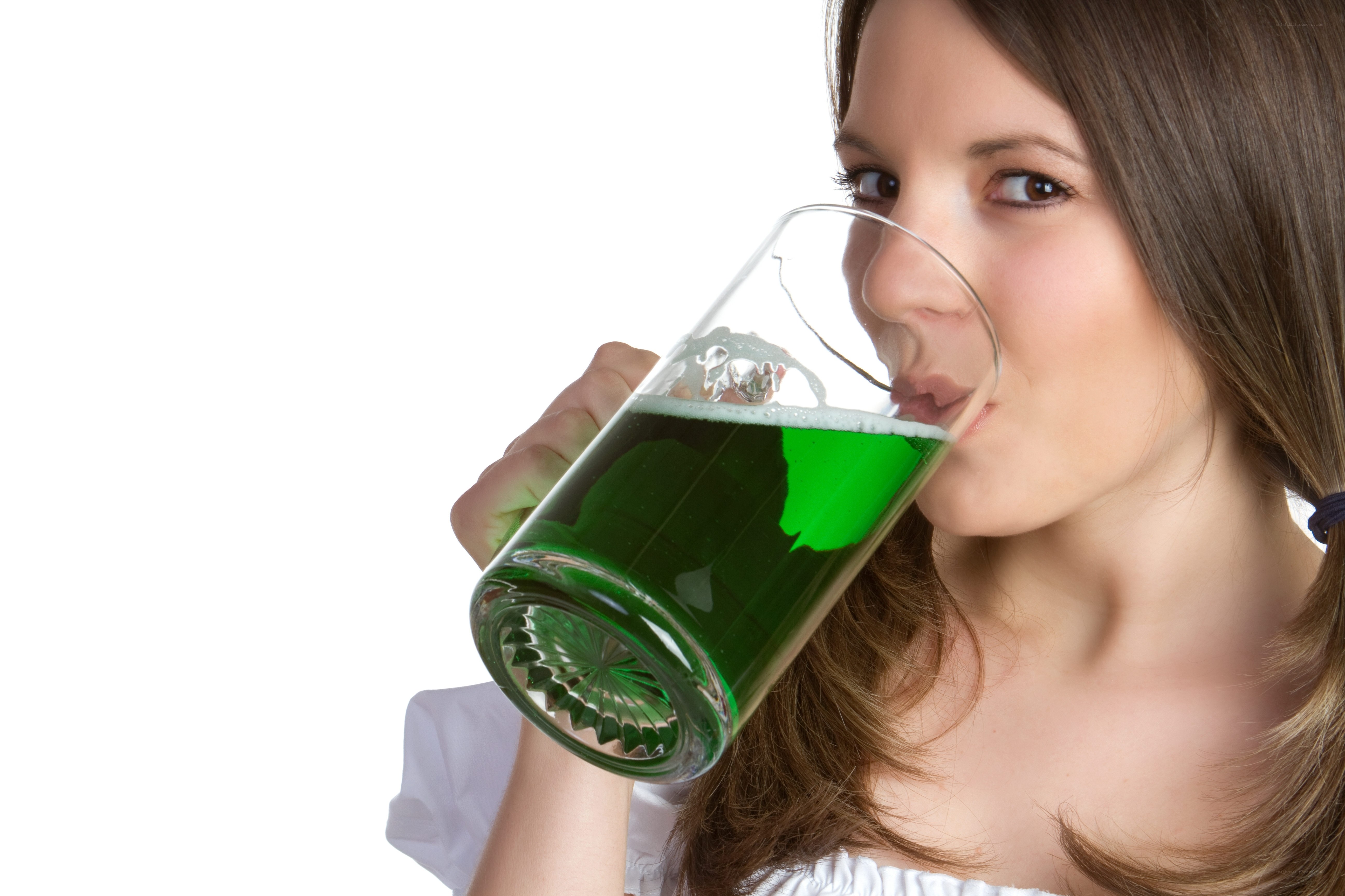 woman drinking green liquid