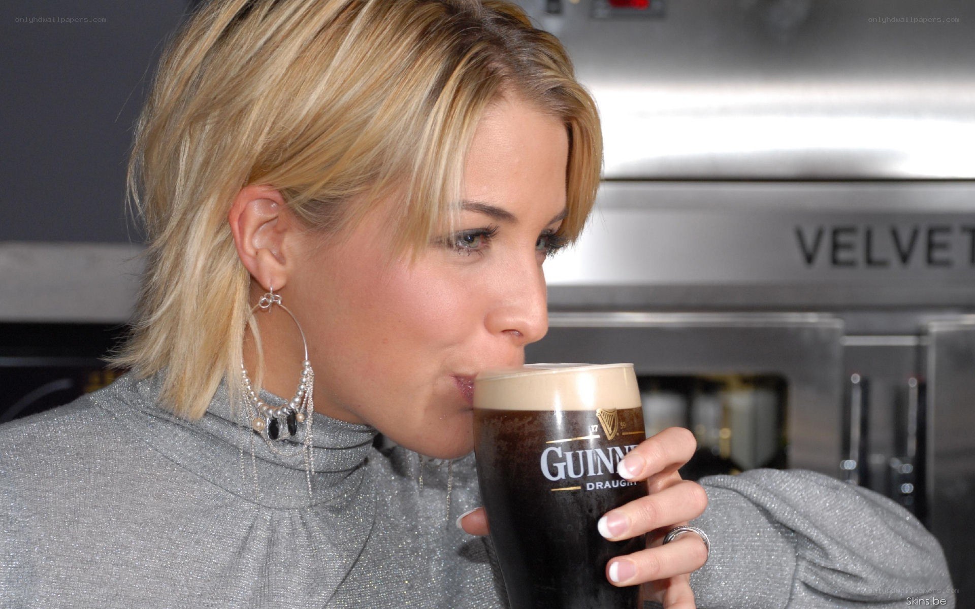 woman drinking guinness beer