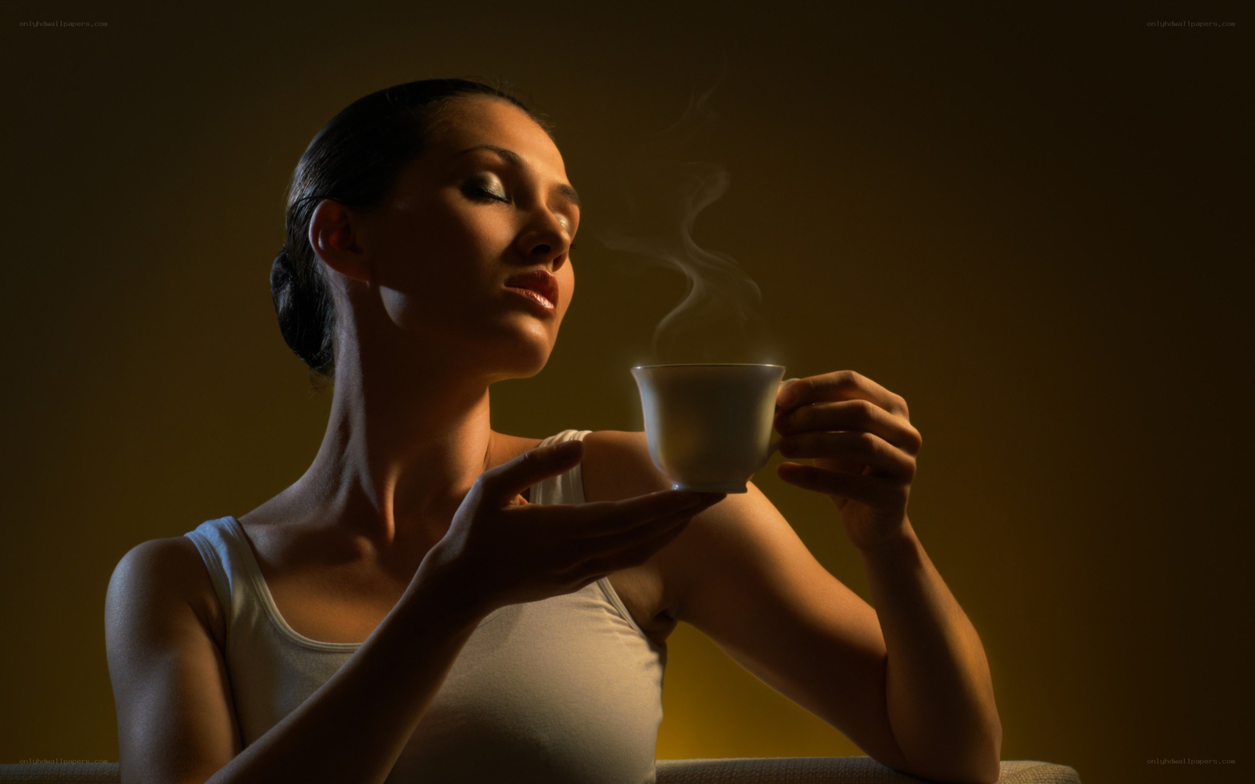woman drinking hot beverage
