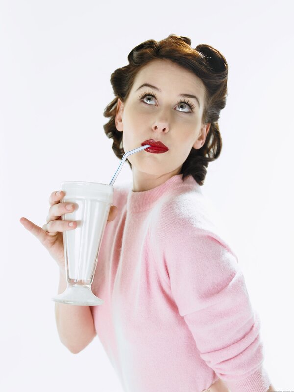 woman drinking milkshake