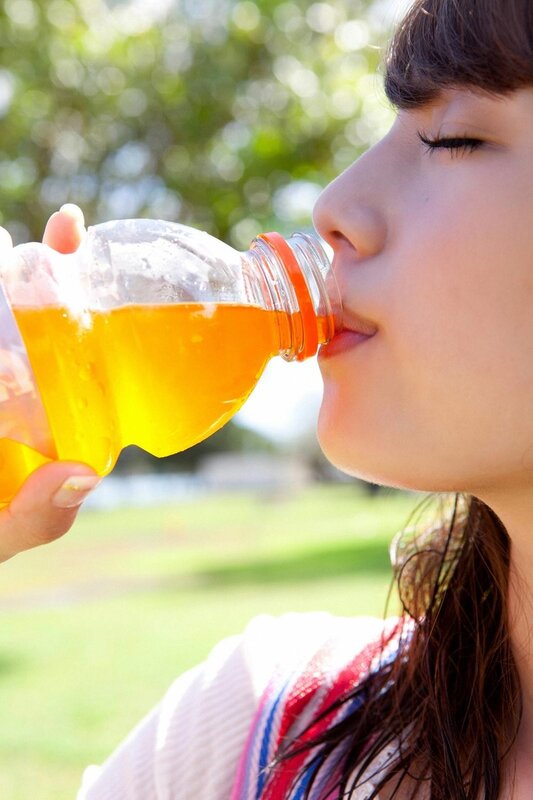 woman drinking orange juice