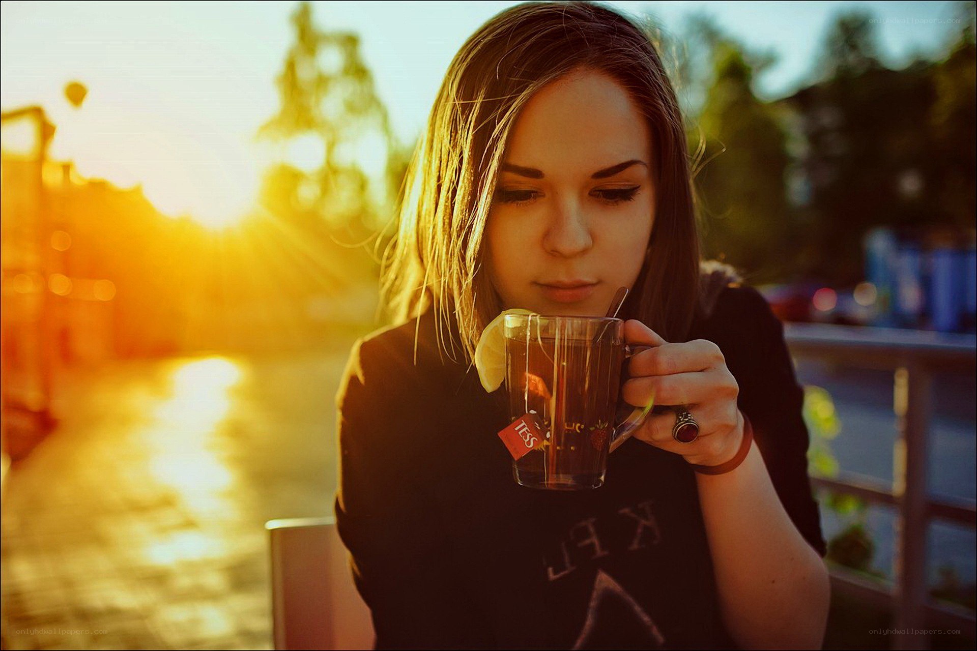 woman drinking tea at sunset