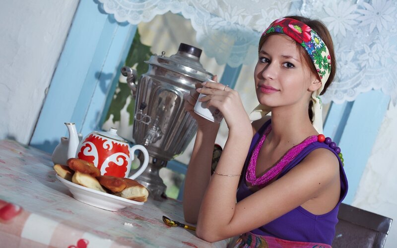 woman drinking tea at table