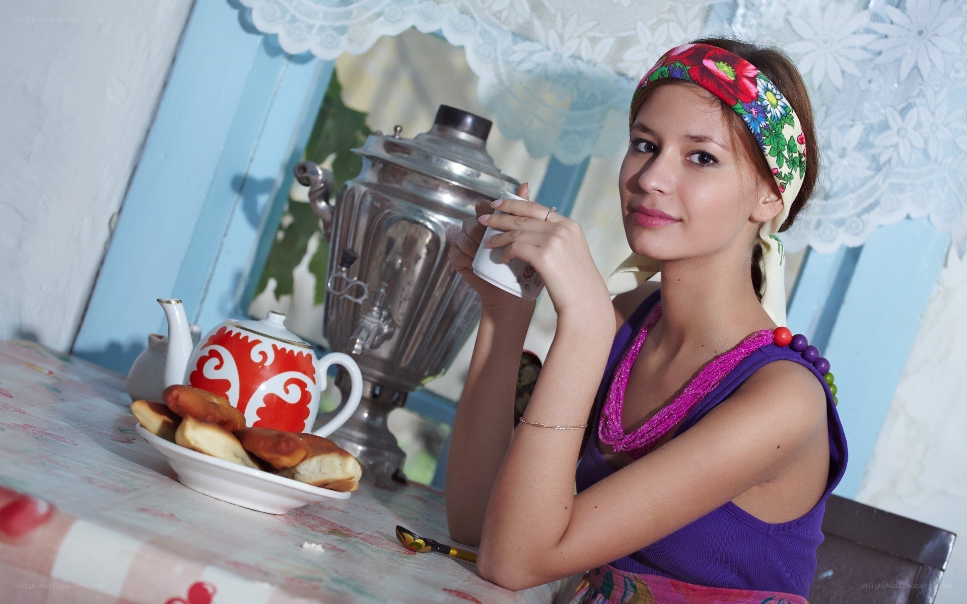 woman drinking tea at table