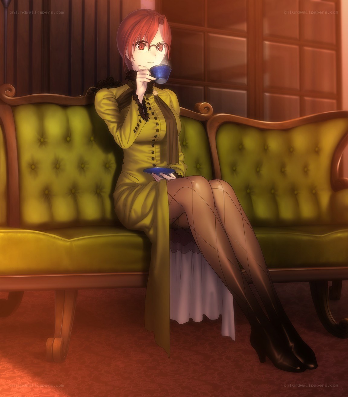 Woman drinking tea on a sofa