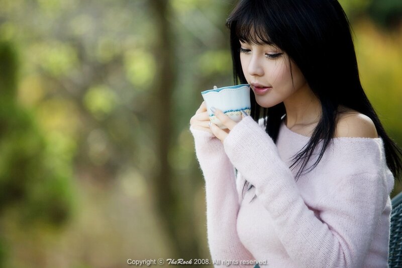 woman drinking tea outdoors