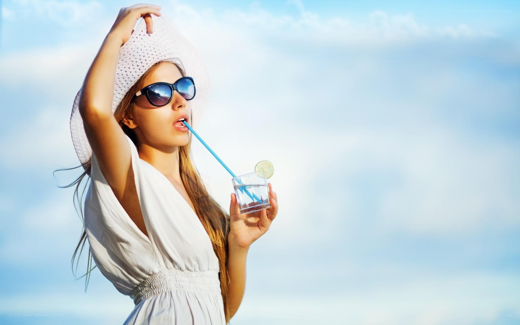 woman drinking with straw