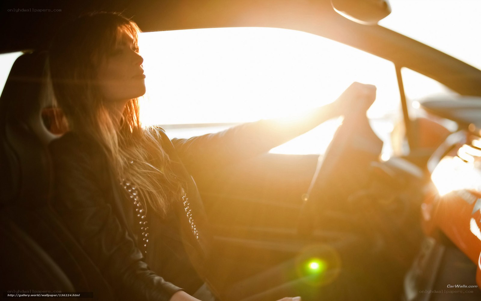 woman driving at sunset