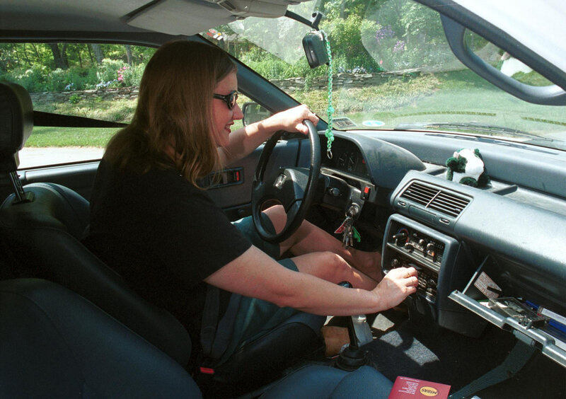 Woman Driving Car — Black