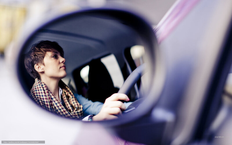 woman driving car in mirror