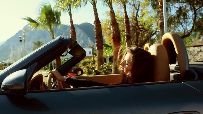 woman driving convertible car