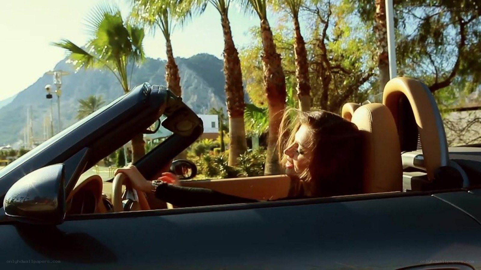 woman driving convertible car