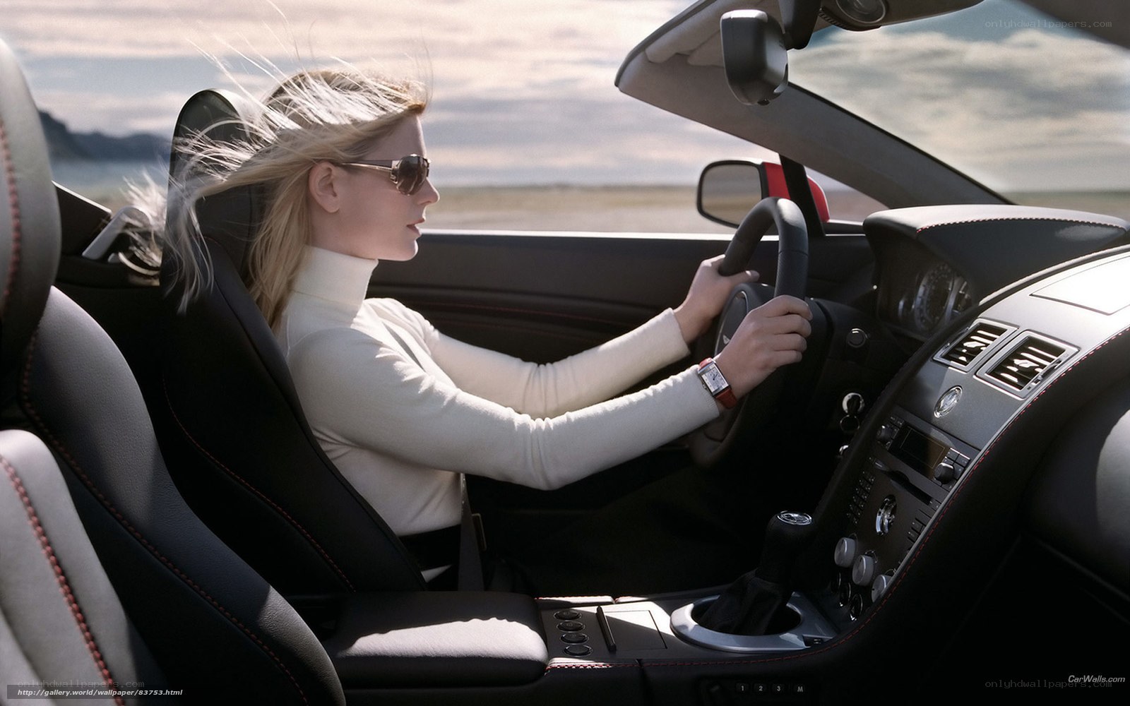 woman driving convertible car