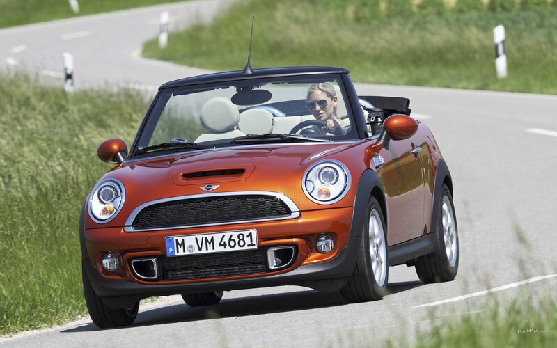 Woman Driving Orange Car — Active