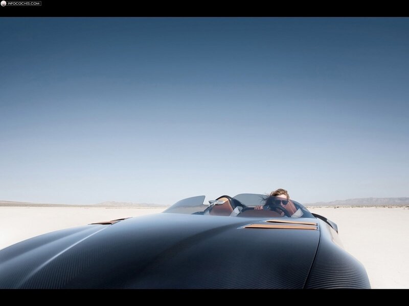 Woman driving sports car in desert