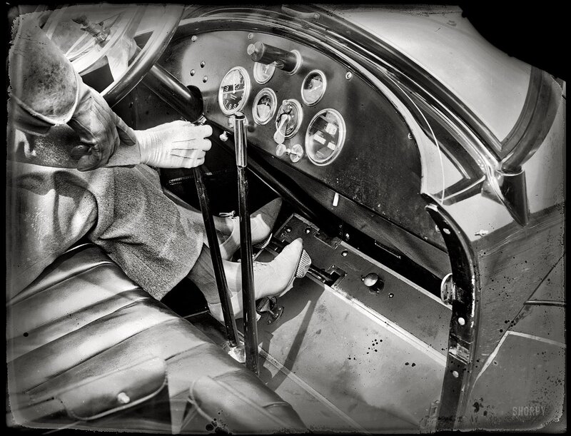 woman driving vintage car