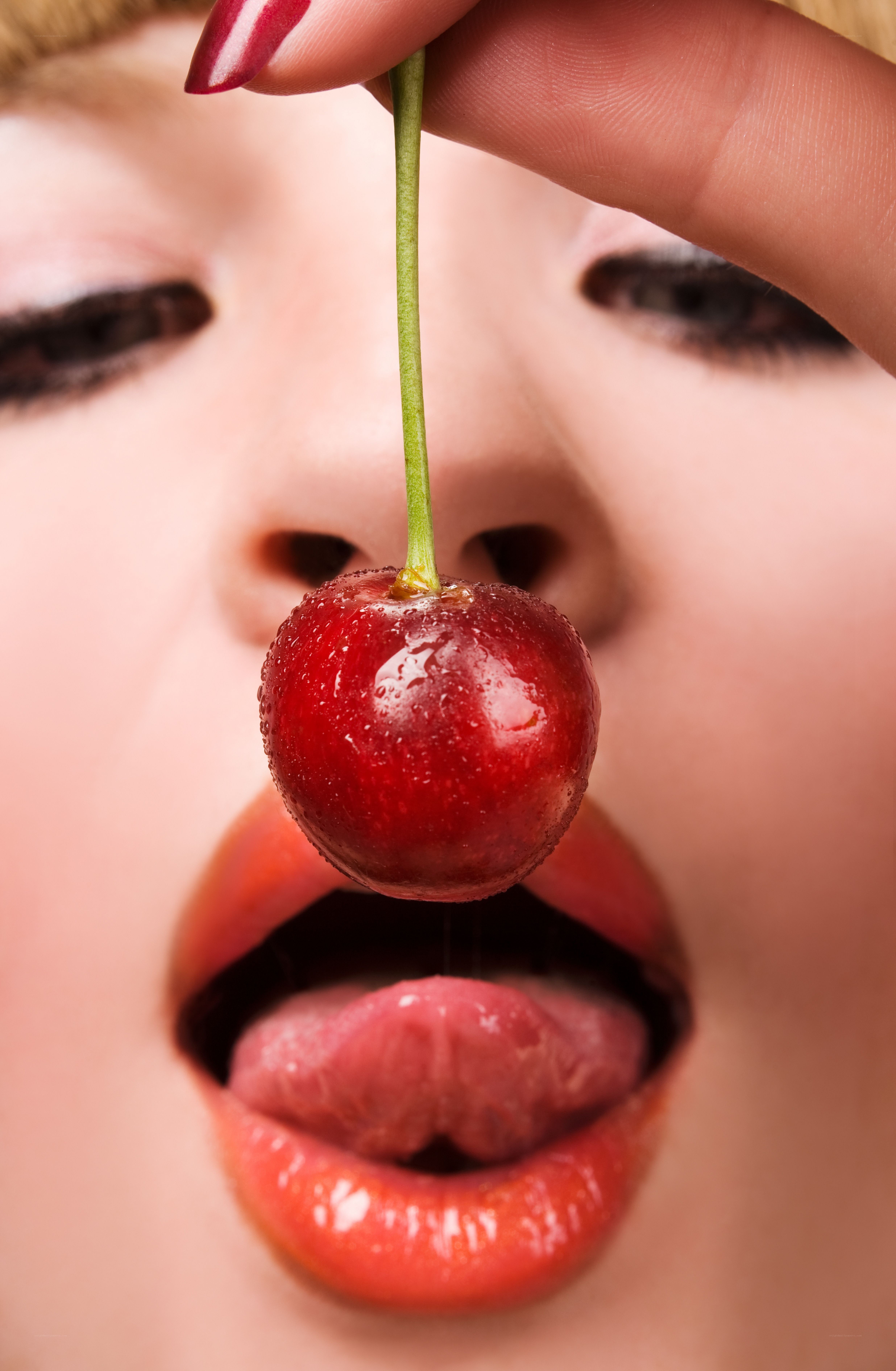 woman eating a cherry