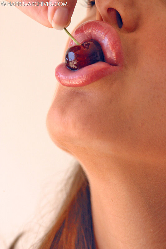 woman eating a cherry