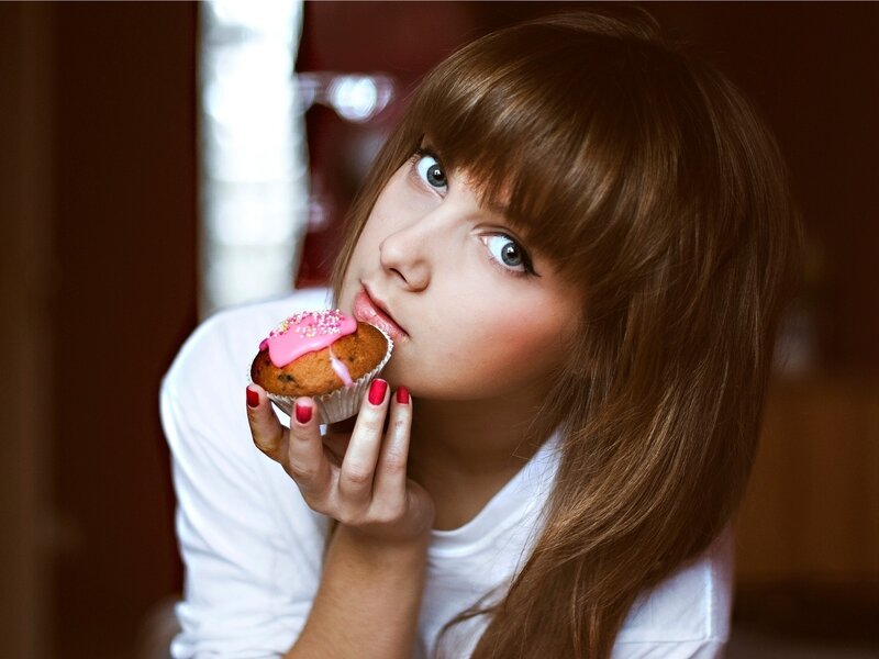 woman eating a cupcake