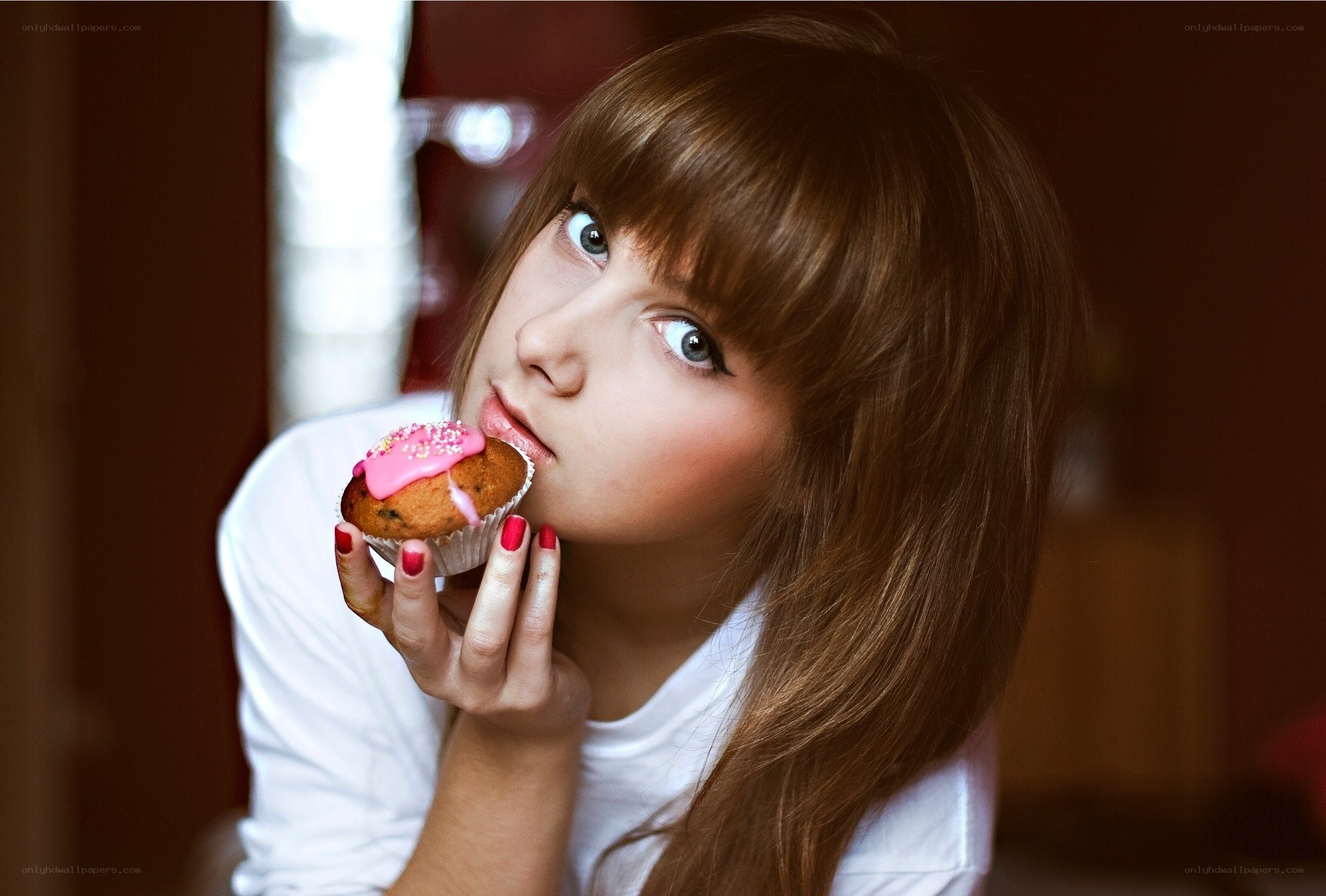 woman eating a cupcake