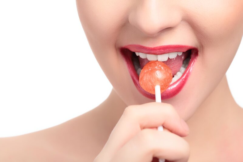 woman eating a lollipop