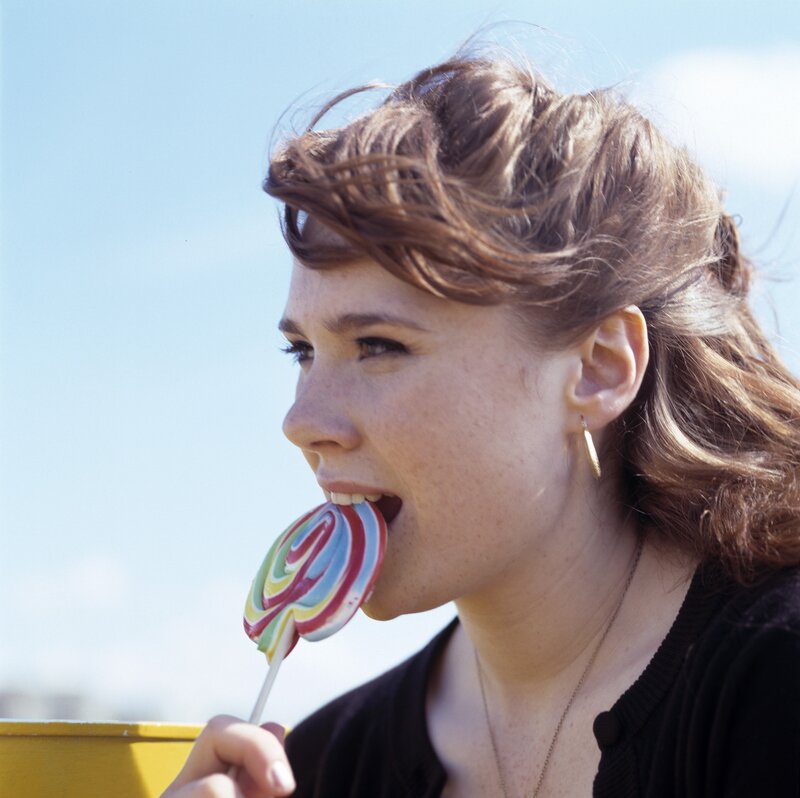 woman eating a lollipop