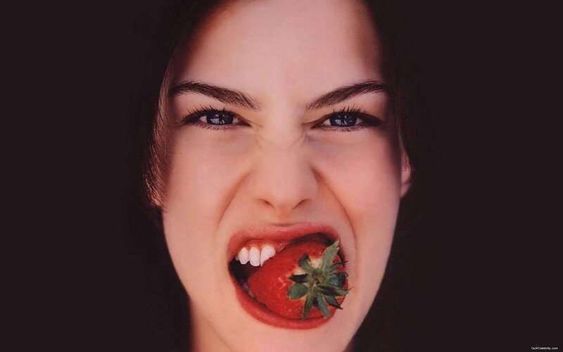 woman eating a strawberry