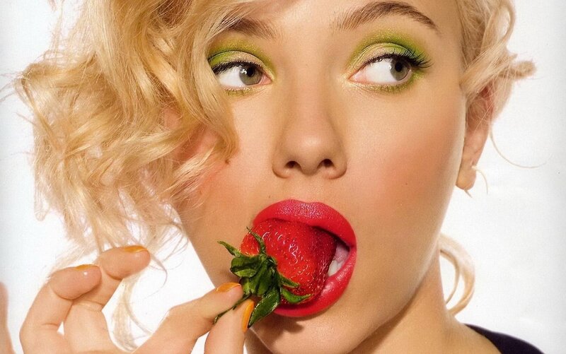 woman eating a strawberry