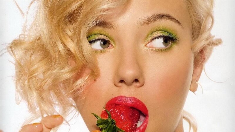 woman eating a strawberry