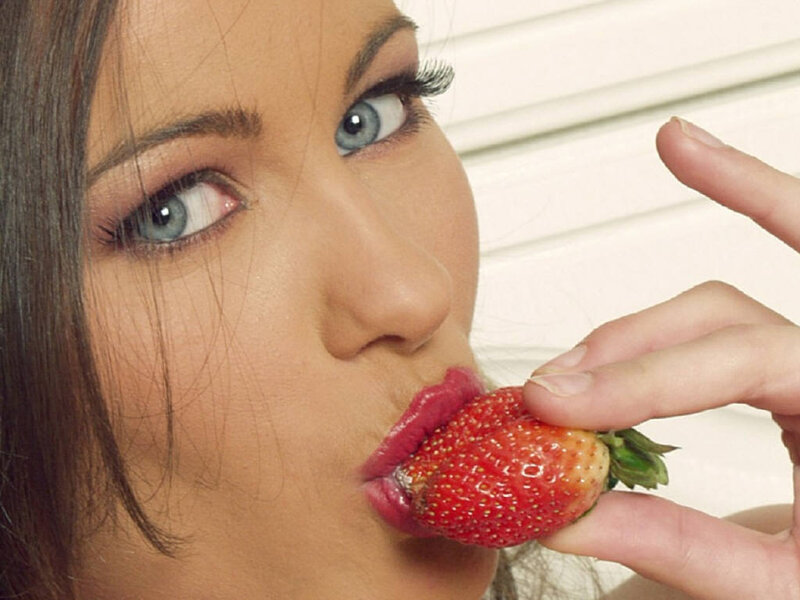 woman eating a strawberry