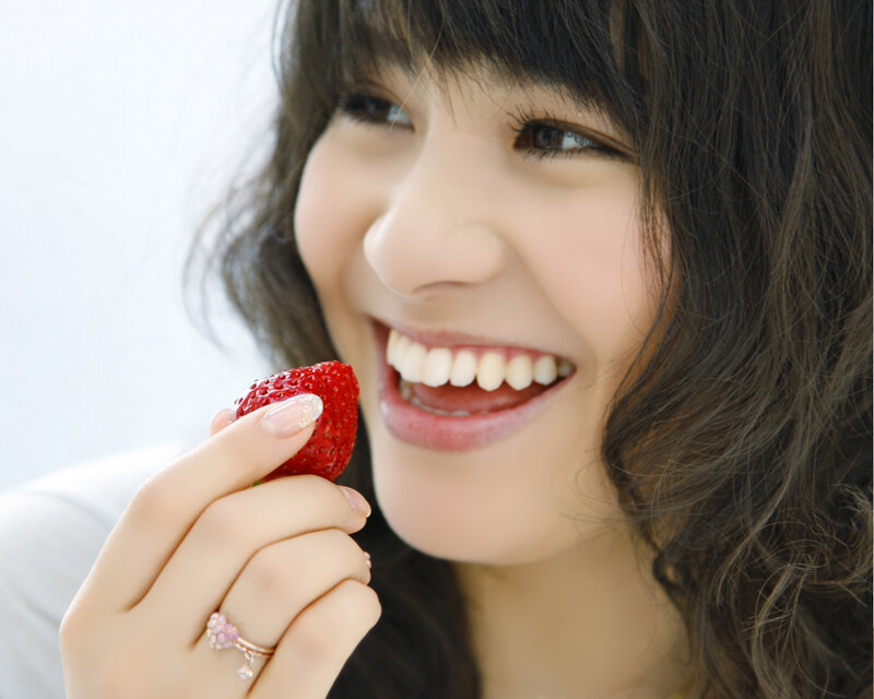 woman eating a strawberry