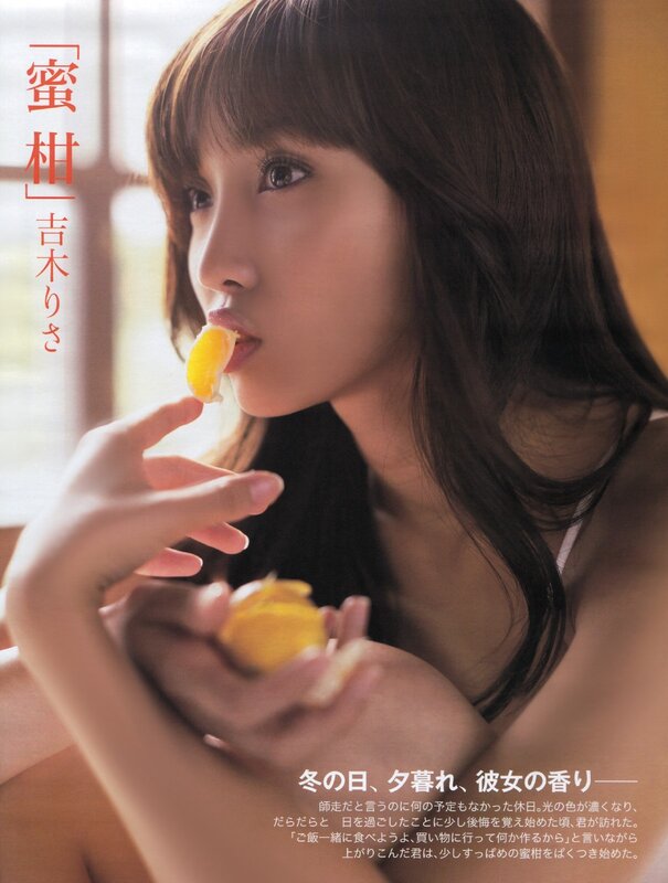 Woman eating a tangerine