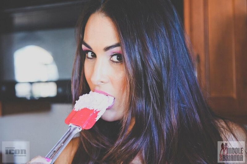 woman eating batter with spatula