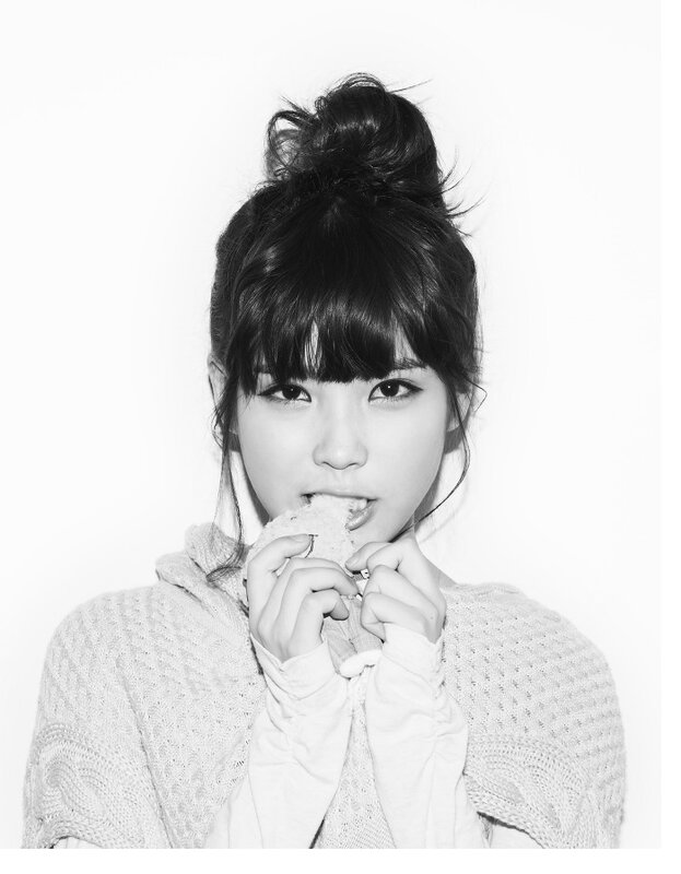woman eating bread in black and white